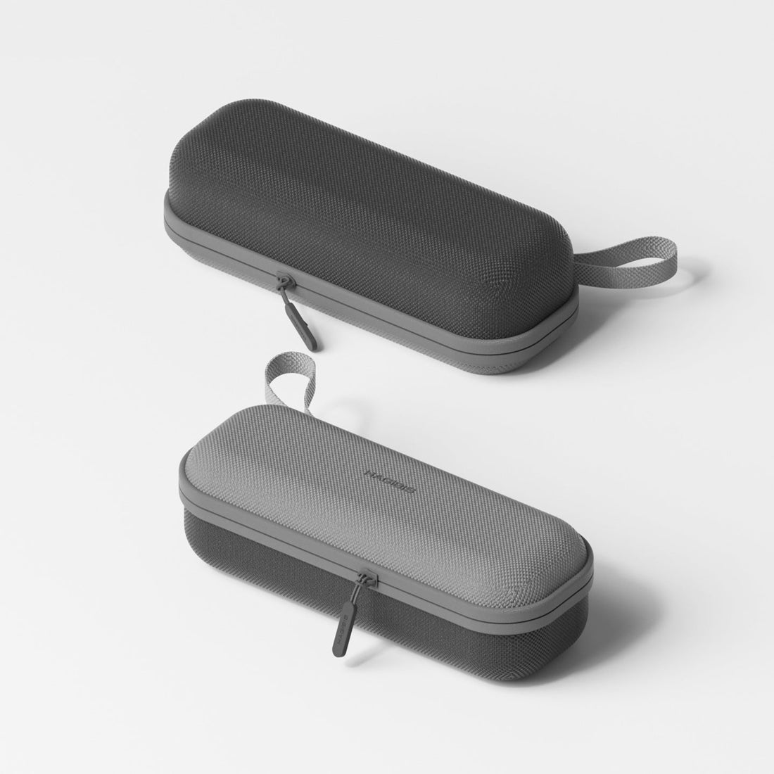 Two gray carrying cases on a white background