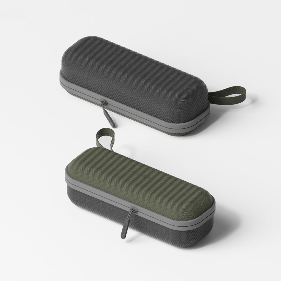 Two gray and green carrying cases on a white background