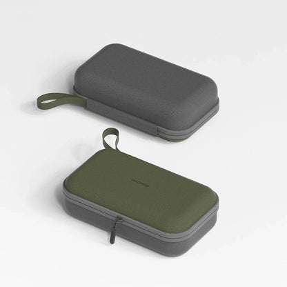 Two carrying cases, one gray and one green, on a light gray background.