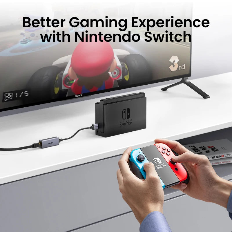 Person holding Nintendo Switch controllers with a TV displaying a racing game, text 'Better Gaming Experience with Nintendo Switch'.