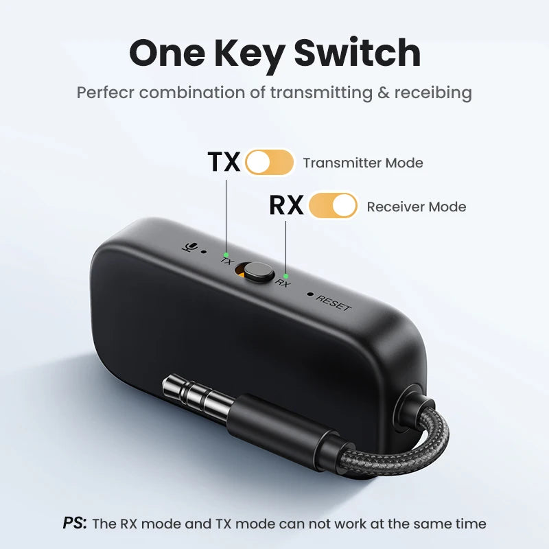Black one-key switch device with TX and RX labels on a light gray background