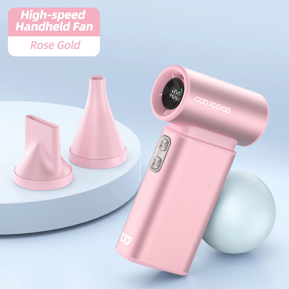 Rose gold handheld fan with two additional nozzles on a light blue background
