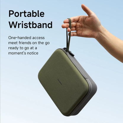 Green portable wristband case held by a hand against a light blue background