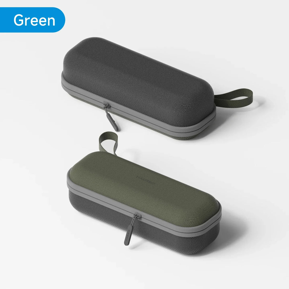 Two black and green hard-shell carrying cases on a light gray background