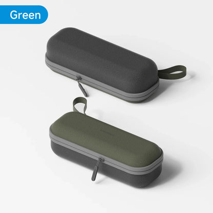 Two black and green hard-shell carrying cases on a light gray background