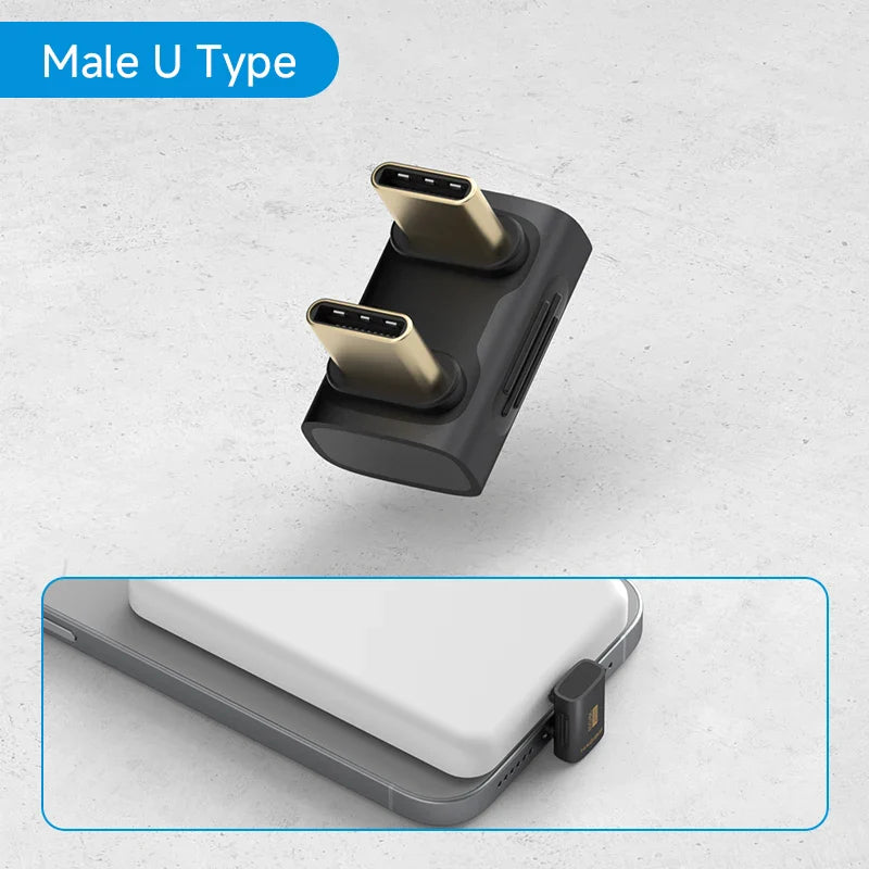 Black USB-C adapter with two ports on a light gray background