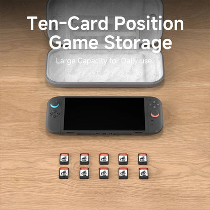 Card storage case with cards and gaming console on a wooden surface