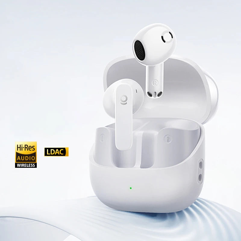 White wireless earbuds with charging case on a light gray background