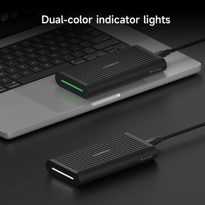 Black USB hub with dual-color indicator lights on a laptop keyboard