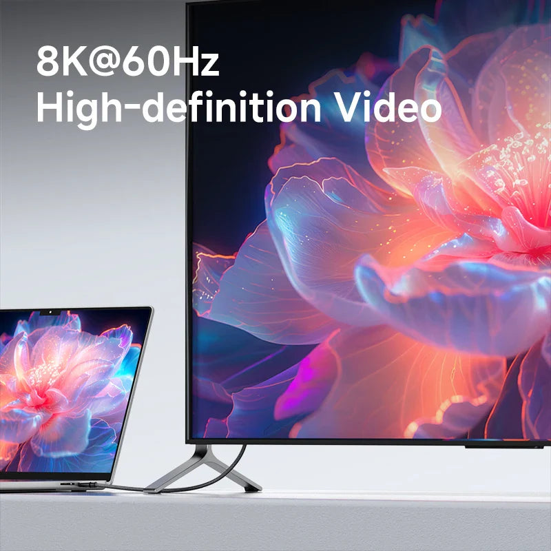 TV and laptop displaying 8K@60Hz high-definition video with a colorful abstract design.