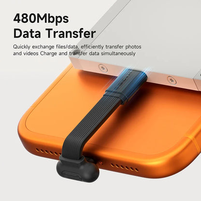 Orange electronic device with a black cable attached, displaying 480Mbps data transfer capabilities.