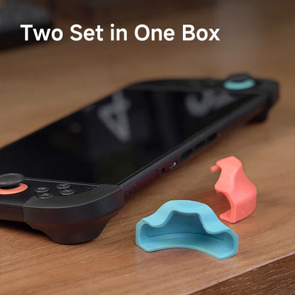 Phone case with two small silicone clips on a wooden surface