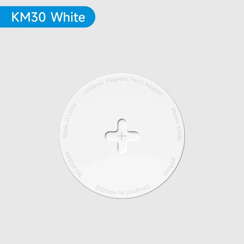 White circular magnetic pad adapter with '+' symbol on a light gray background, labeled 'KM30 White'.