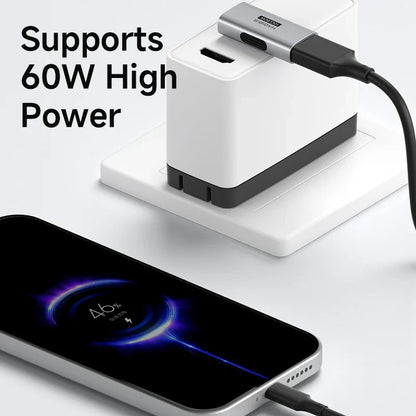 White power adapter with multiple ports and a smartphone being charged, on a light gray background.