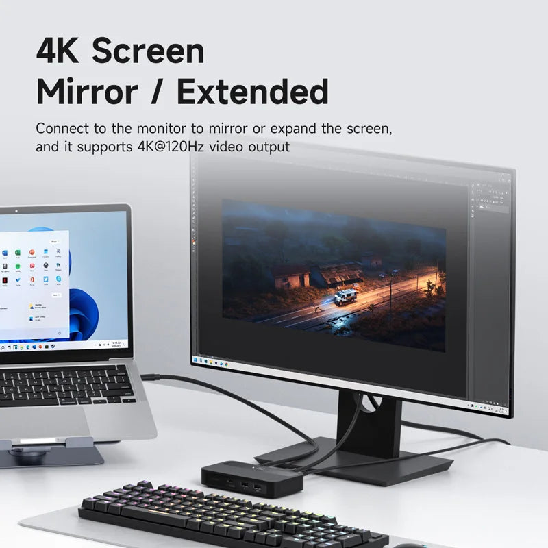 Computer setup with a monitor, keyboard, and laptop displaying 4K screen mirroring or extended feature.