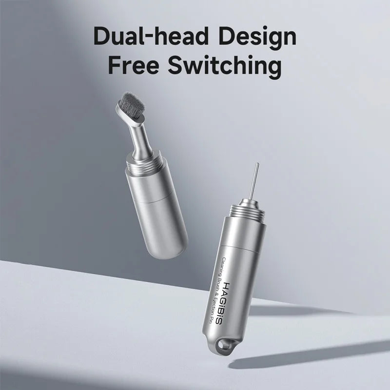 Two metallic tools with dual-head design on a gray background