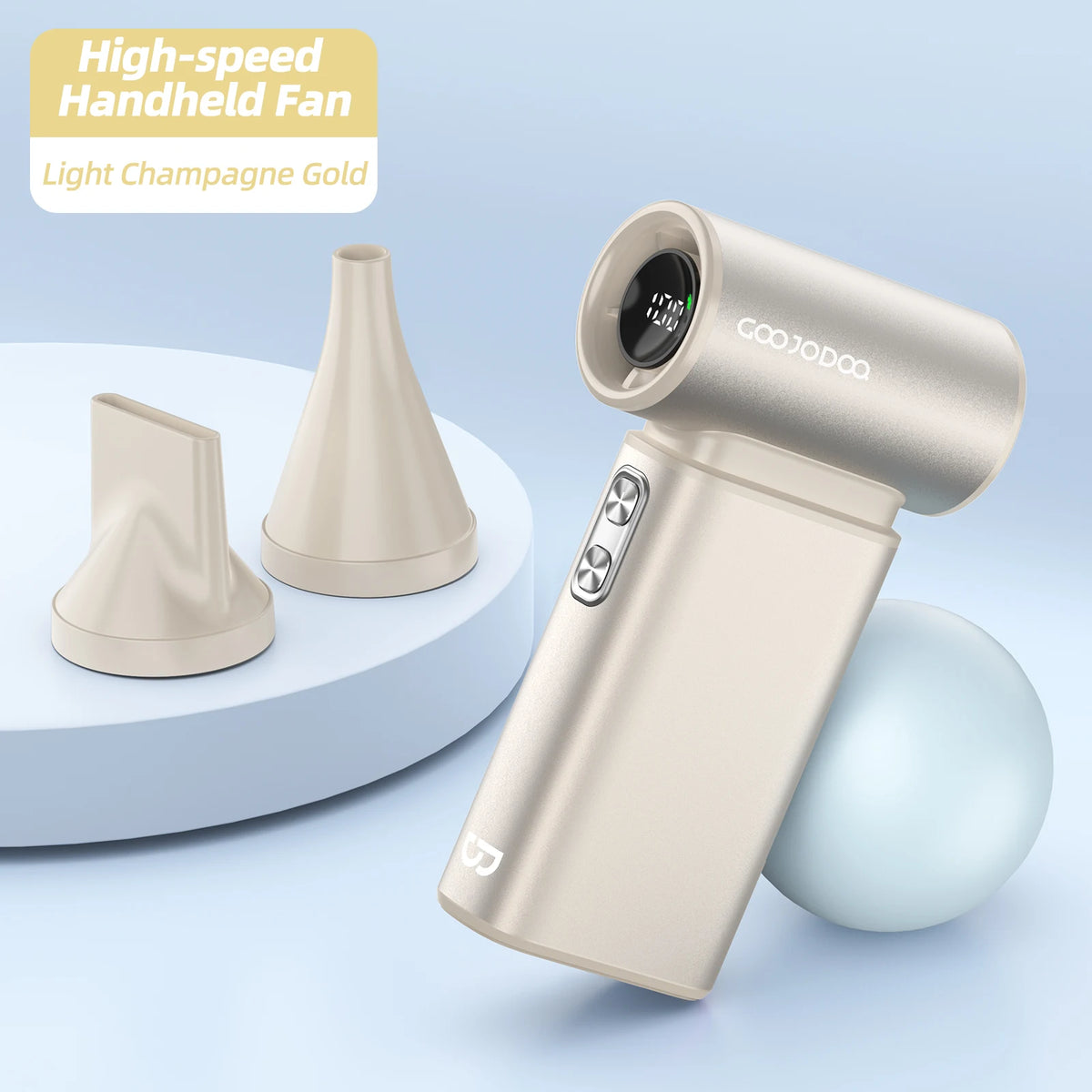 Handheld fan in light champagne gold color with attachments on a light blue background