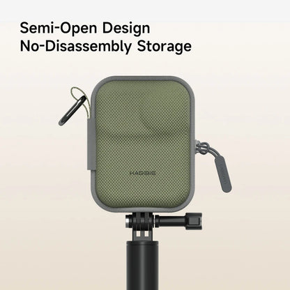 Green microphone pop filter on a stand with 'HAGIBIS' branding against a beige background.
