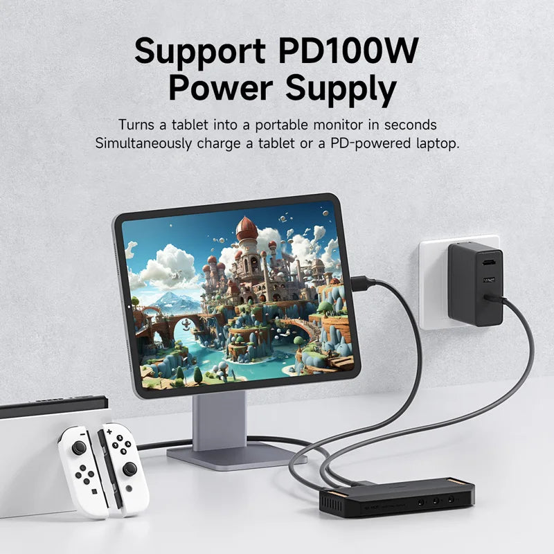 Tablet docked with a monitor displaying a game, connected to a power supply on a light gray background.