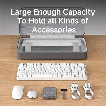 Gray carrying case with a white keyboard and accessories on a wooden surface