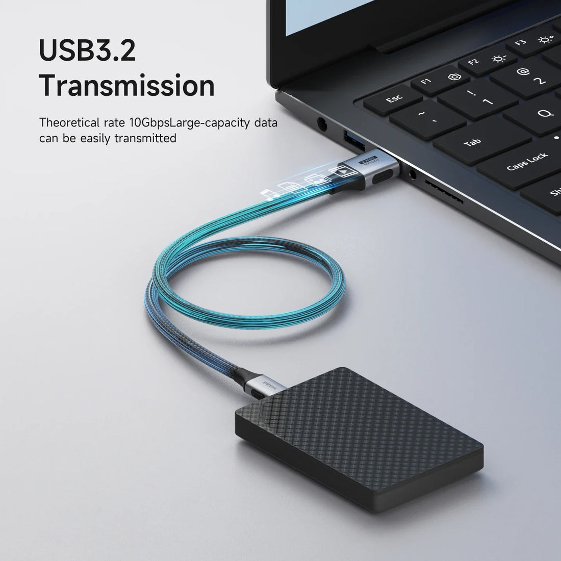 USB drive connected to a laptop with USB cable, highlighting USB3.2 transmission.