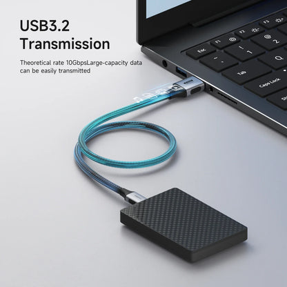 USB drive connected to a laptop with USB cable, highlighting USB3.2 transmission.