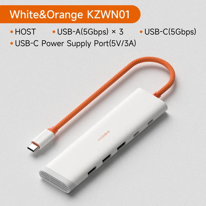 White USB hub with orange cable on a light gray background