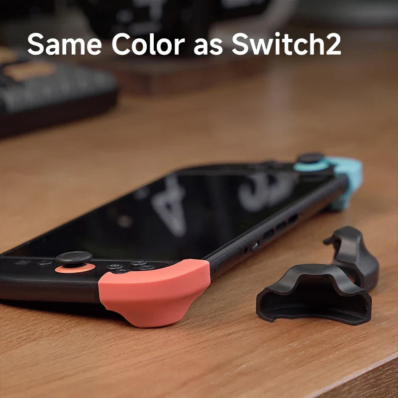 Phone case with pink and black accents on a wooden surface, text 'Same Color as Switch2'.