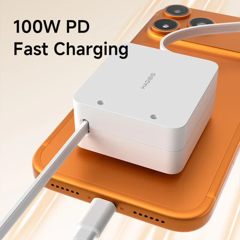White charging adapter with cable on an orange surface, labeled '100W PD Fast Charging'.