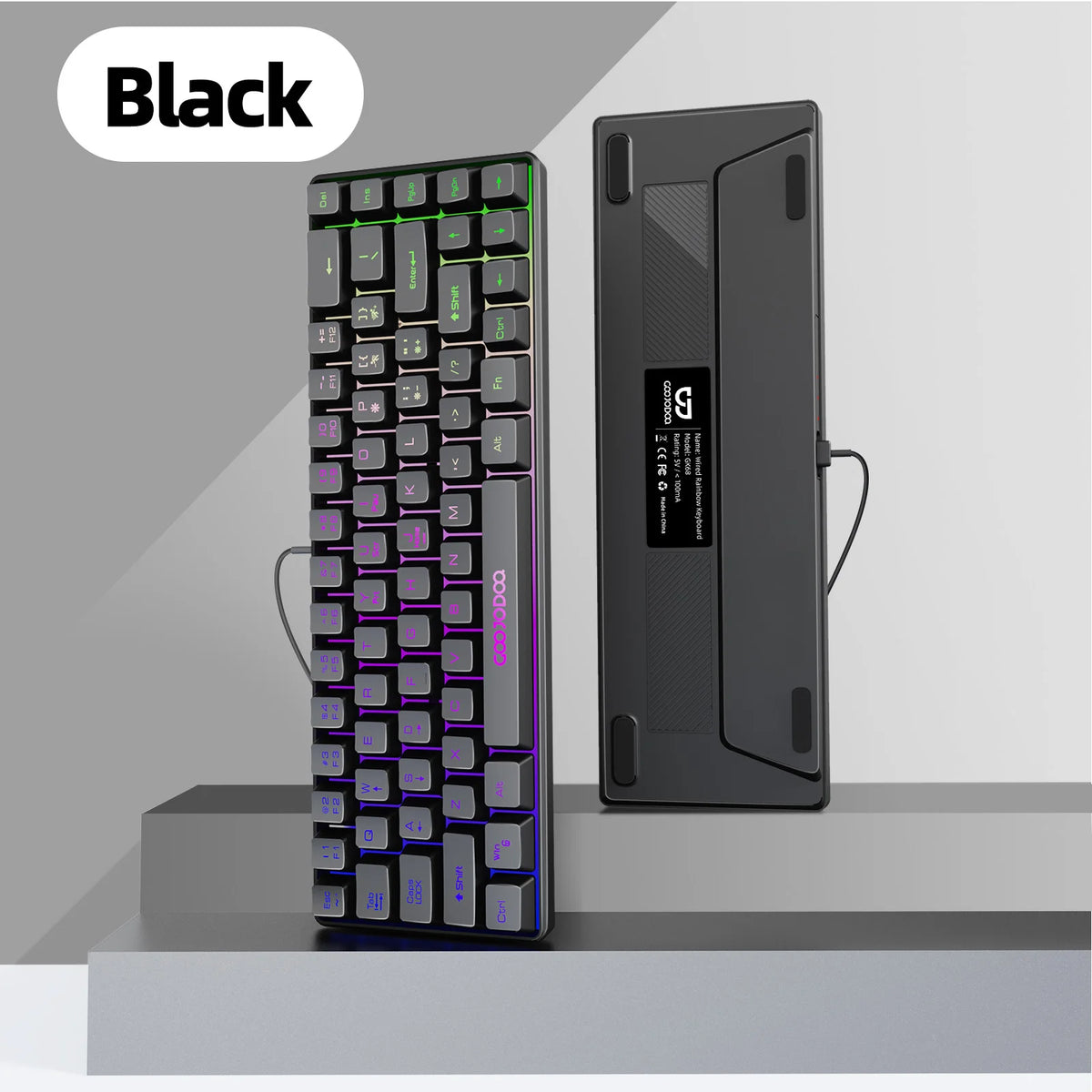 Black keyboard with illuminated keys on a gray background