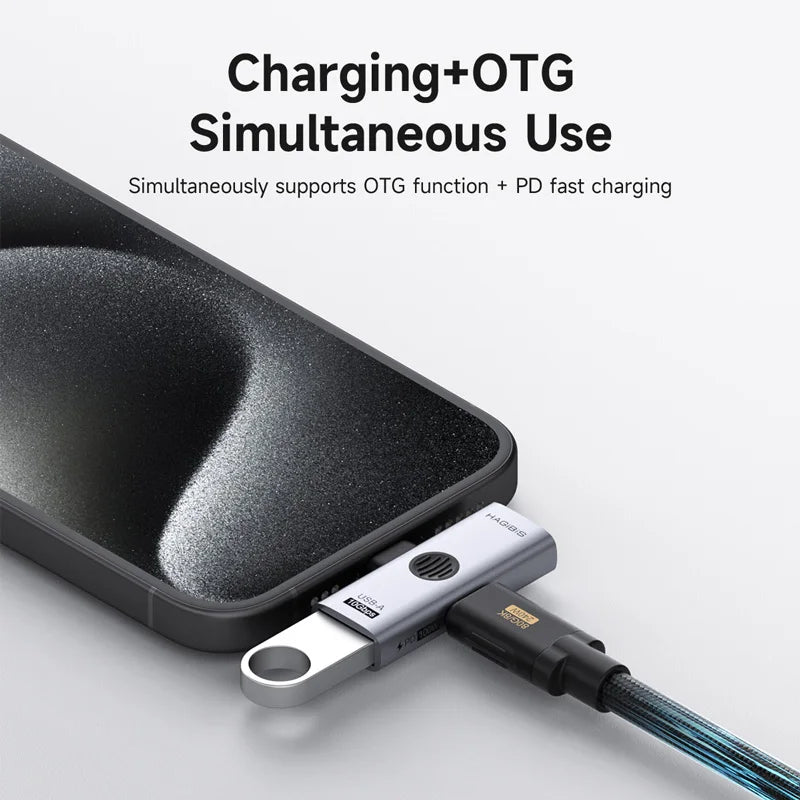 Phone with a charging cable and adapter on a white background, featuring text about simultaneous charging and OTG use.