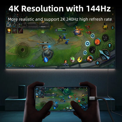 Person playing a game on a smartphone with a TV displaying the same game, emphasizing 4K resolution and 144Hz refresh rate.