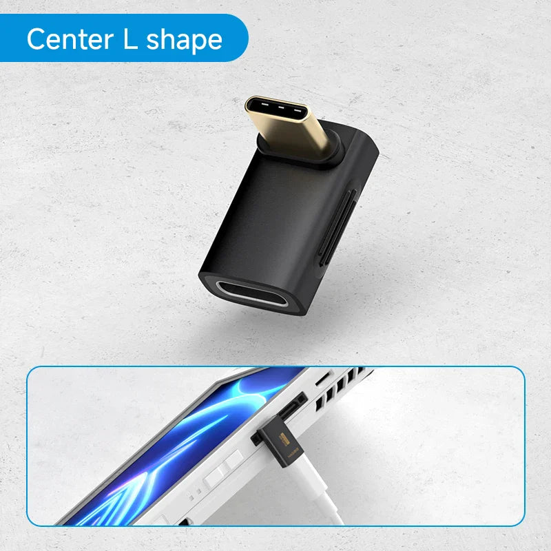 Black L-shaped adapter with USB-C and headphone jack on a light gray background