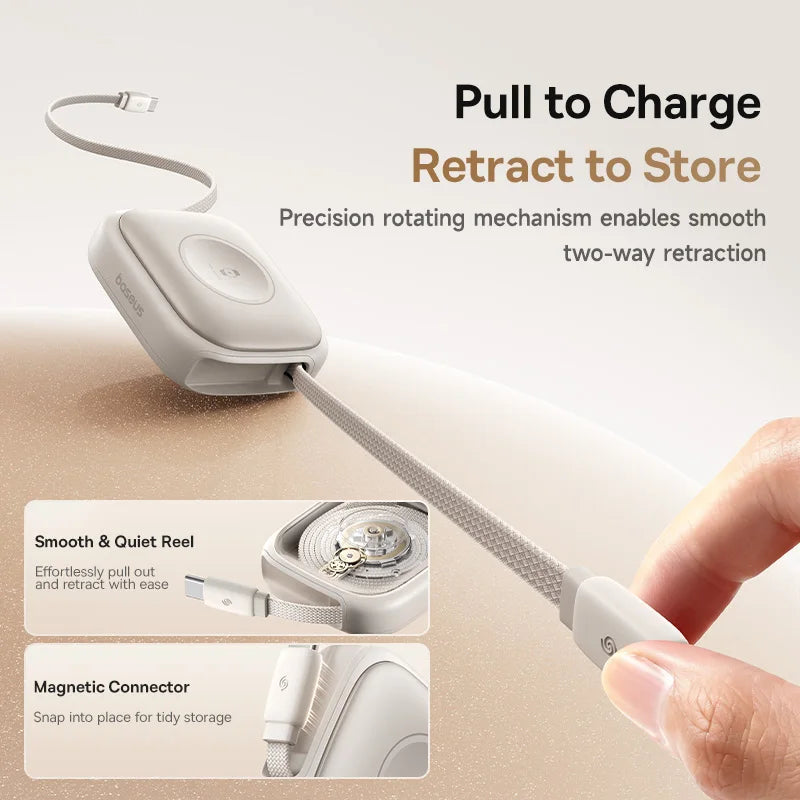 Retractable cable with charging mechanism and hand demonstrating use on a beige background