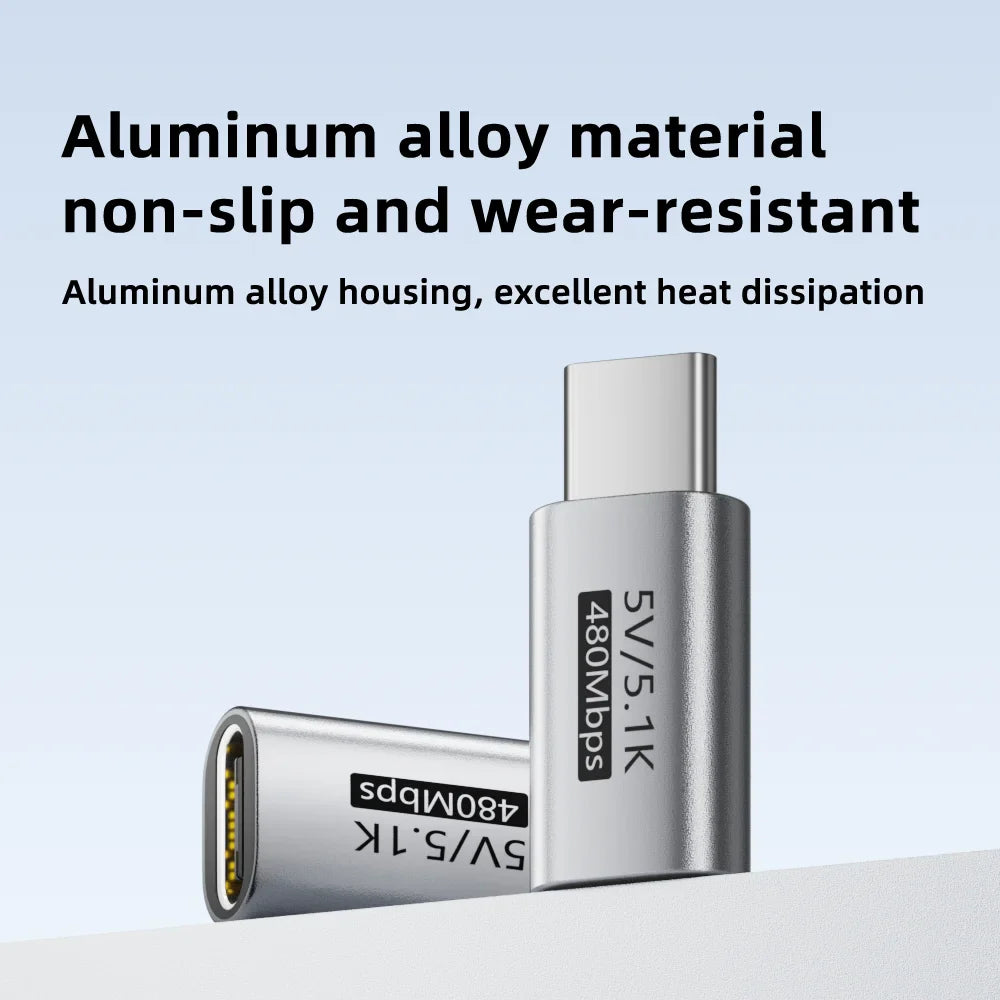 Metallic USB adapter with text on a light blue background