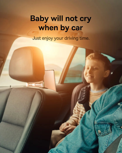 Child sitting in a car seat with a parent, smiling, with text overlay.