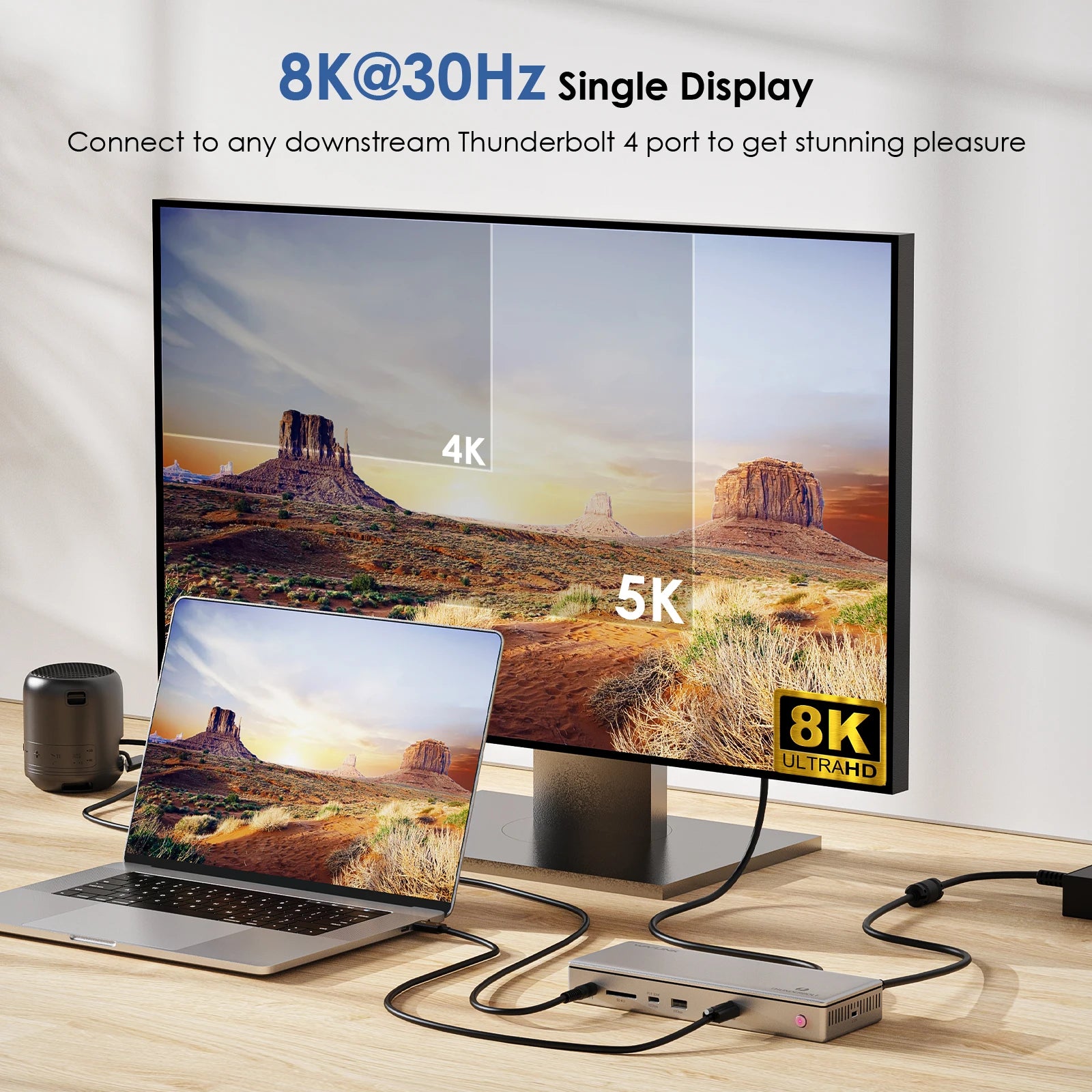 Monitor displaying a scenic landscape with laptop and hub on a wooden surface, featuring 8K@30Hz text.