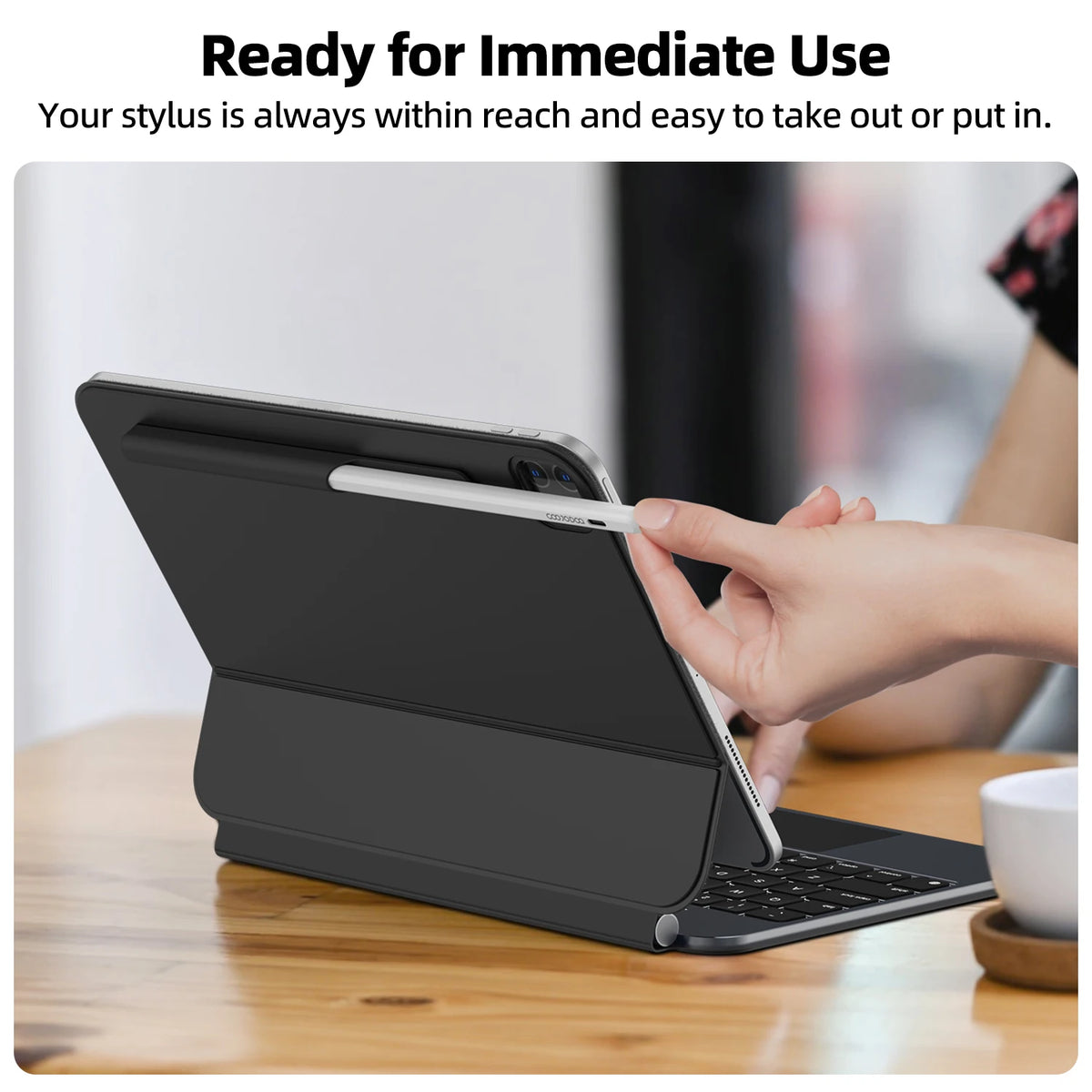 Black tablet case with keyboard and stylus on a wooden table