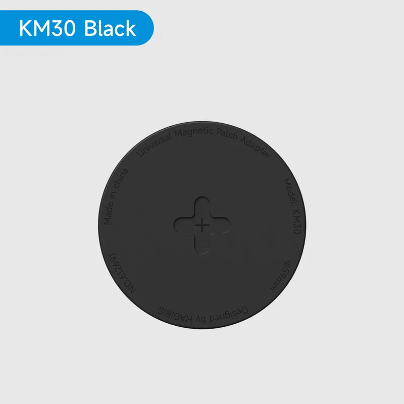 Black circular magnetic pad with 'KM30 Black' label on a gray background