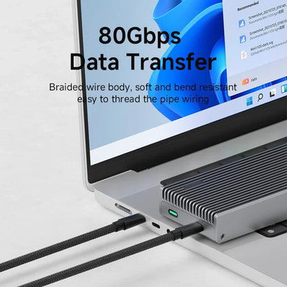 Laptop with a USB cable connected, emphasizing 80Gbps data transfer capability.