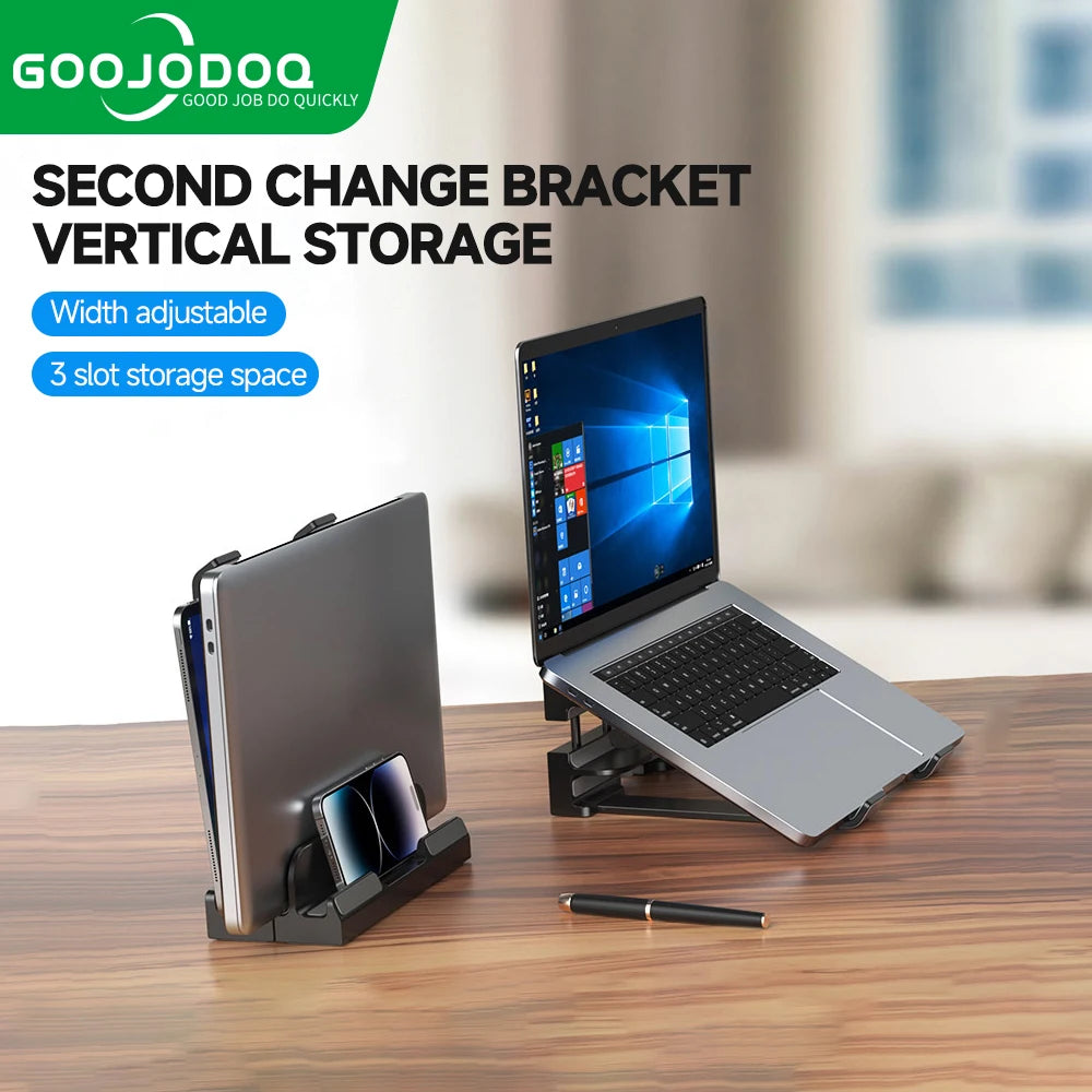 A black vertical laptop stand with adjustable slots, featuring a laptop and a tablet placed on it, showcasing the stand's ability to hold devices vertically.