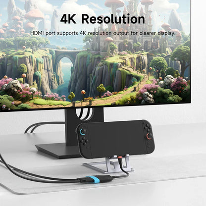 Phone dock with 4K resolution display showing a fantasy landscape on a white surface.