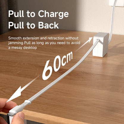 Extension cable with pull-to-charge and pull-to-back feature on a wooden desk.