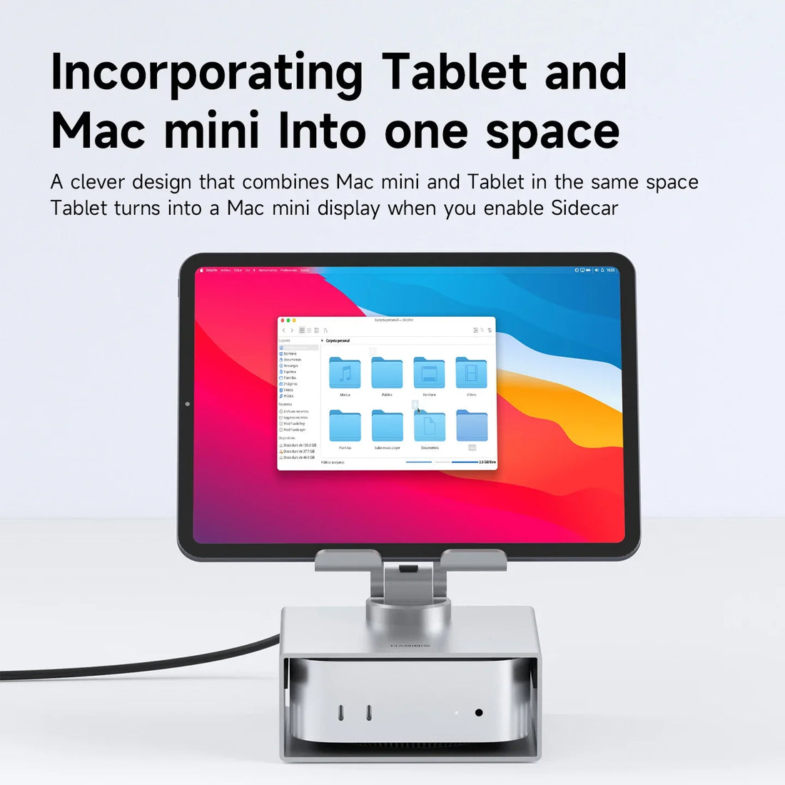 Tablet docked with a screen displaying a Mac mini interface on a white background