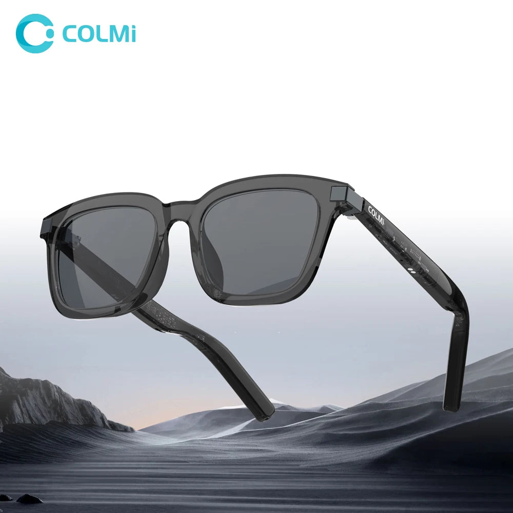 Black sunglasses with gray lenses on a mountainous landscape background, featuring the COLMi brand.