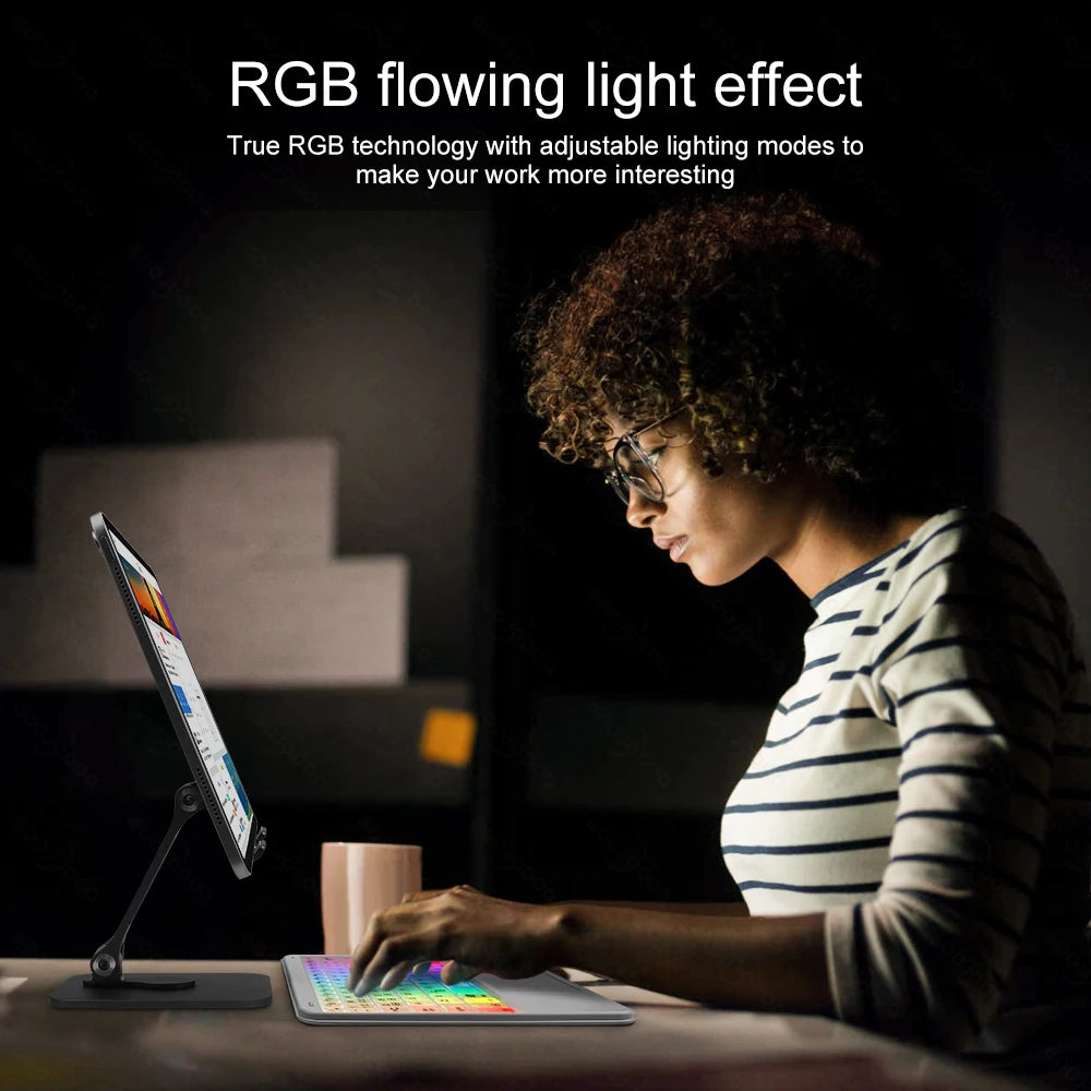 Person using a tablet with an RGB flowing light effect in a dark room