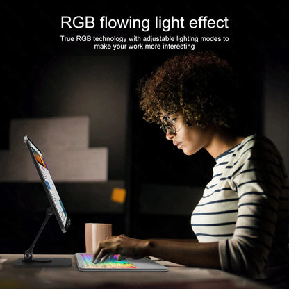 Person using a tablet with an RGB flowing light effect in a dark room