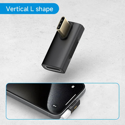 Black L-shaped adapter with USB-C and micro-USB ports on a gray background