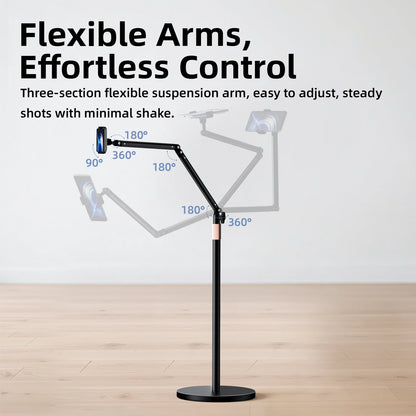 Black adjustable phone or tablet stand with flexible arms on a wooden floor.