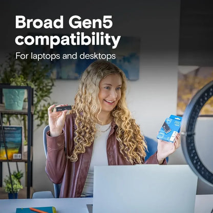 Woman holding a small device and a box with text about Broad Gen5 compatibility for laptops and desktops.
